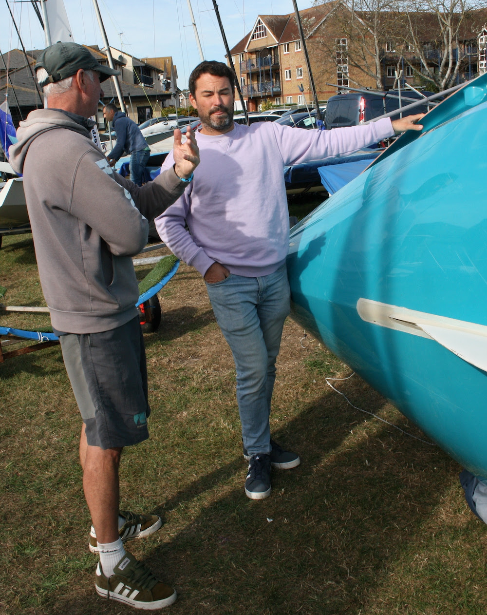 Steve Irish – Endeavour coach – offers some timely advice on his walk around the dinghy park before the afternoon’s on-the-water training session – photo Sue Pelling